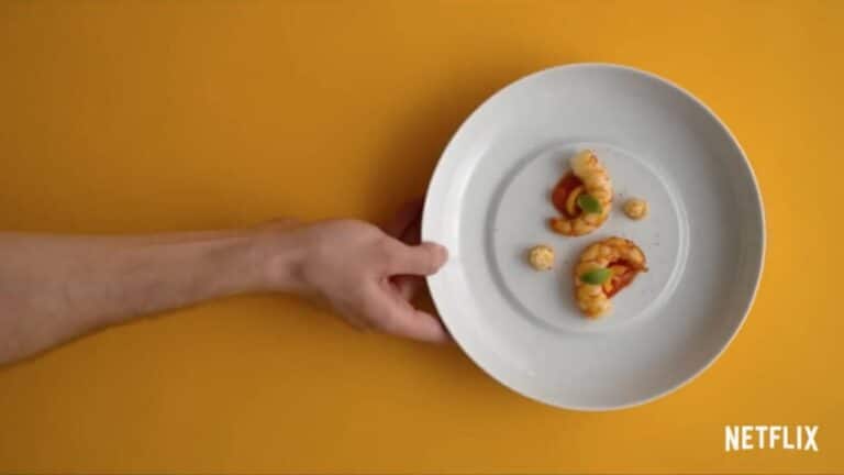 Minimalist plate with a small, carefully arranged dish.