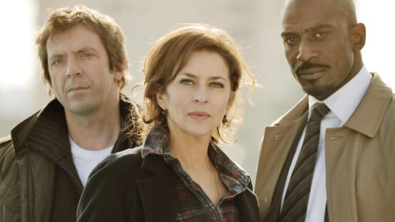 Three people standing side by side, looking directly at the camera.